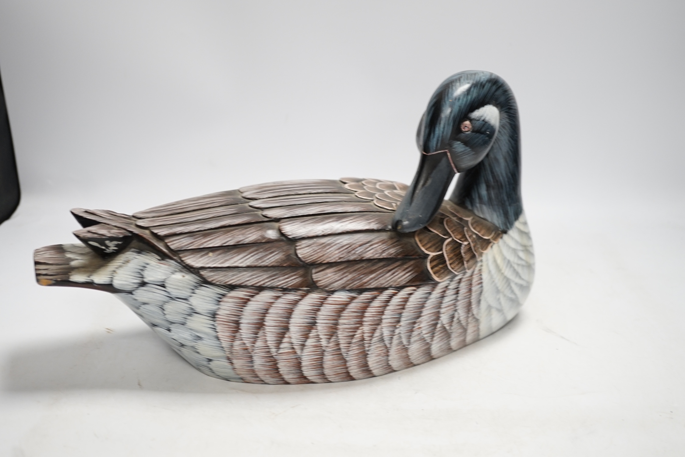 A Chinese carved wood duck and a brass bell, bell 25cm high. Condition - fair